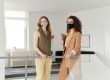 two women with masks in workplace